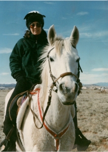 Riding my mare Opal one blustery day when she had a lot of energy. She was retired early because of melanomas. Photo taken Winter, 1998. 
